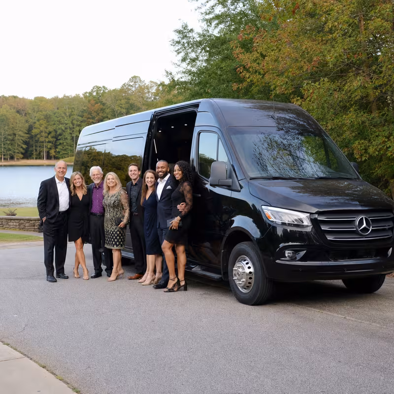 Group beside a Mercedes Sprinter limo from the Greensboro fleet