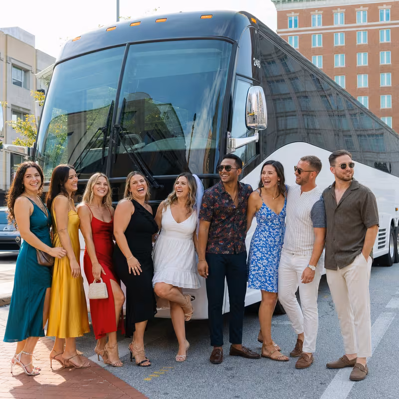 Passengers loading luggage while boarding an Greensboro group shuttle