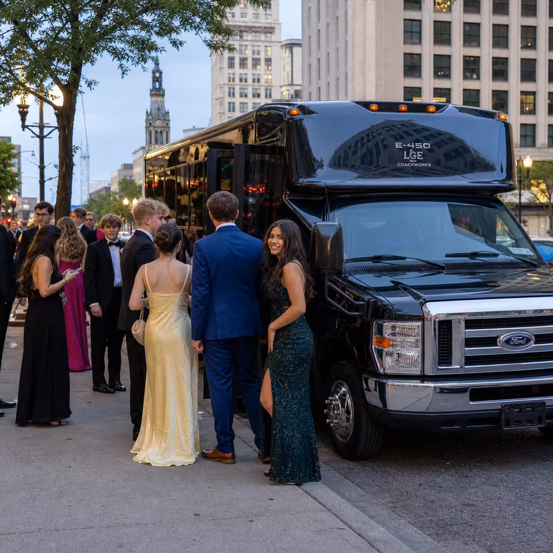 Passengers loading luggage while boarding an Greensboro group shuttle