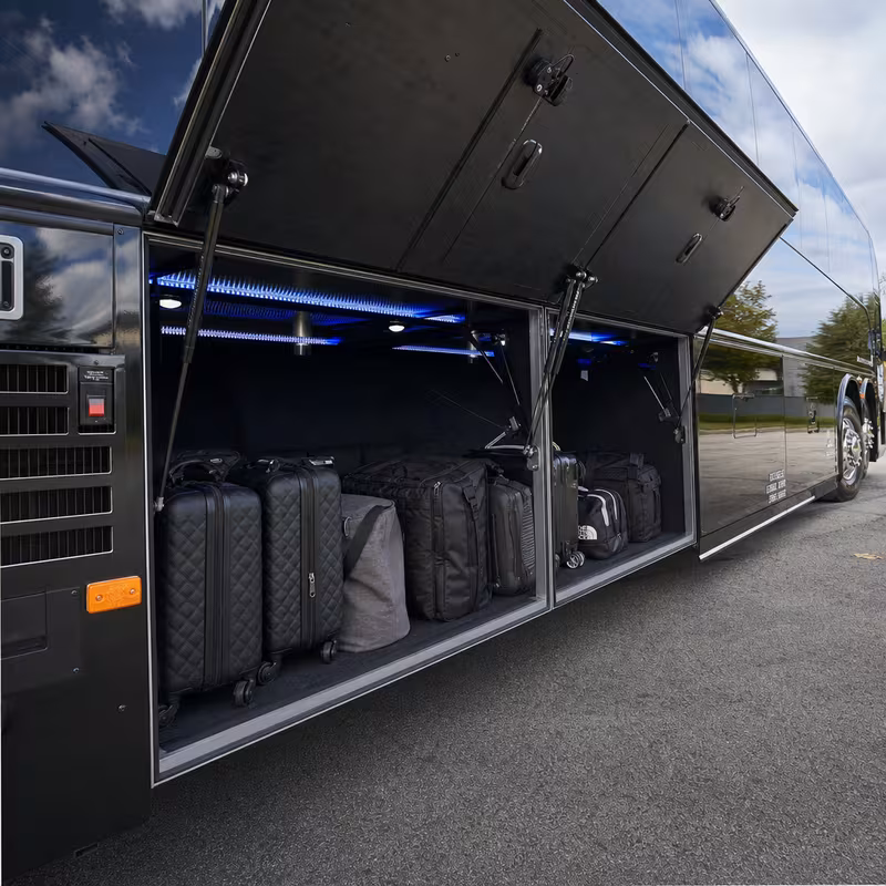 Party bus interior with wraparound leather seating and LED lighting in Greensboro