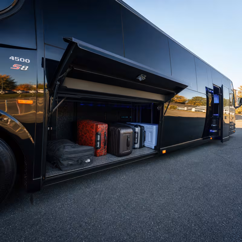 Party bus interior with wraparound leather seating and LED lighting in Greensboro